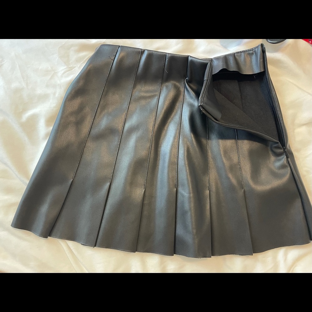 Black leather pleated mini skirt